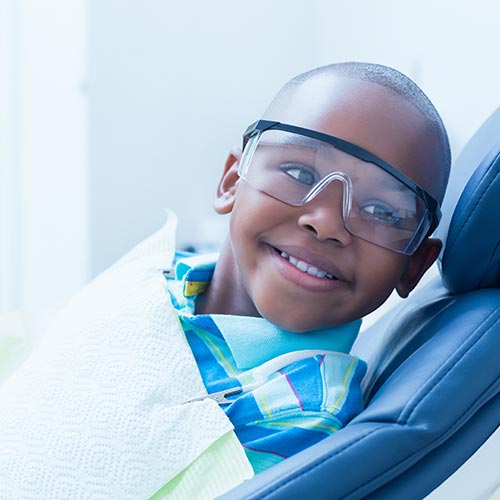smiling boy waiting for dental exam, general dentistry in Mississauga