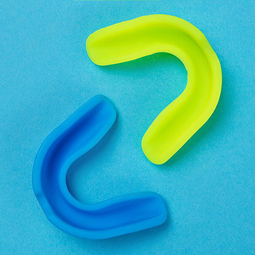 Colourful sports mouthguard on dentist table