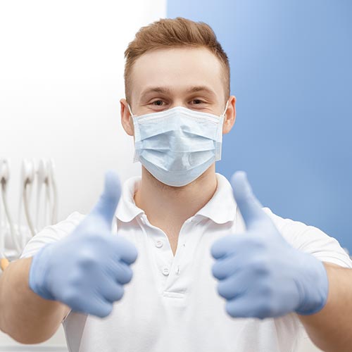 Dentist giving assurance to patients after his tooth extraction